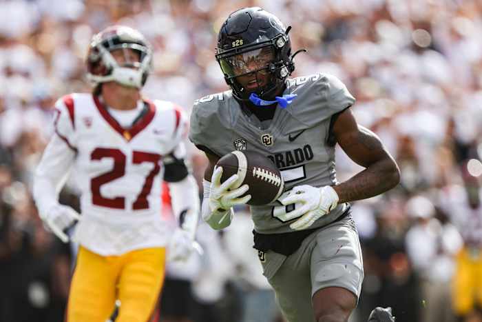 Colorado Buffaloes wide receiver Jimmy Horn Jr. (5) runs the ball in for a touchdown in the second quarter of the game against the USC Trojans at Folsom Field